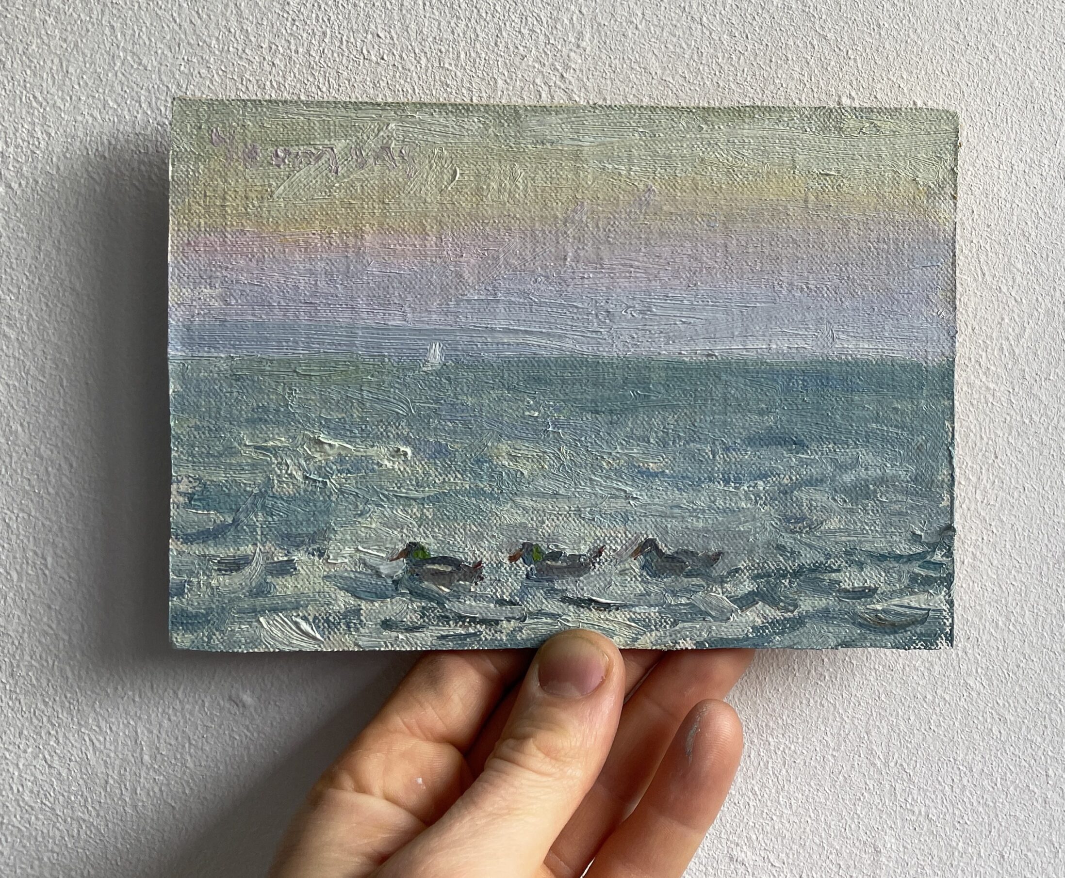 Une peinture a l'huile de trois canards au crépuscule .Lac Léman